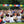 Groupe en méditation bouddhiste en plein air sous drapeaux tibétains colorés