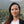 Femme souriante en Himalaya, lien avec la philosophie bouddhiste tibétaine et méditation