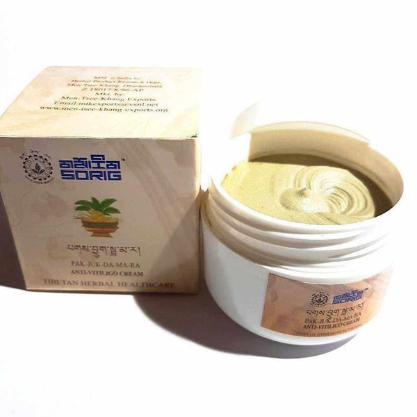 Crème anti-vitiligo tibétaine Pak-Juk-Da-Ma-Ra, soin herbal traditionnel avec boîte et pot ouvert