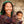 Femme tibétaine souriante avec bébé, écharpe traditionnelle, culture himalayenne