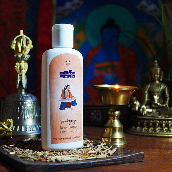 Huile de massage bébé tibétaine Jeepac-Juknum, soin naturel avec éléments bouddhistes et herbes séchées