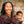 Femme tibétaine souriante avec bébé, écharpe traditionnelle, culture himalayenne