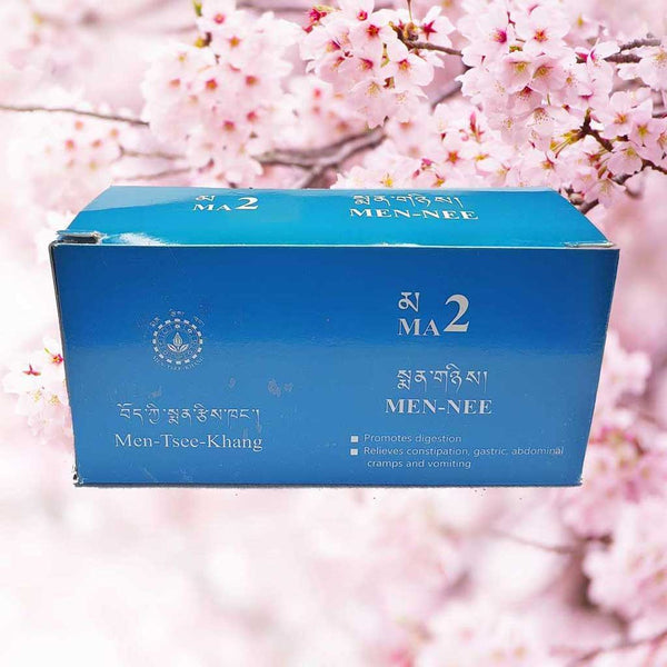 Boîte MA2 Men-Nee de médecine tibétaine pour digestion et soulagement des maux abdominaux, fleurs de cerisier en arrière-plan