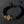 Bracelet bouddhiste en lave et bois avec nœud mystique doré, symbole de la philosophie tibétaine