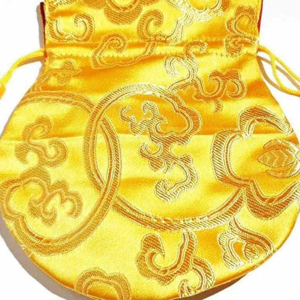 Sac tibétain en soie dorée avec motifs traditionnels bouddhistes
