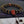 Bracelet bouddhiste tibétain avec perles noires gravées et pendentif rouge, symbole de méditation et spiritualité