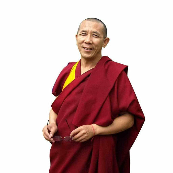 Moine bouddhiste tibétain en robe rouge, enseignant la méditation et la philosophie bouddhiste
