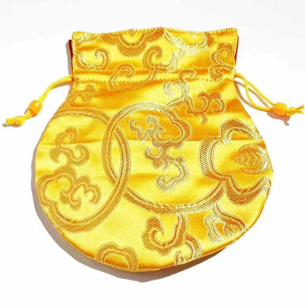 Pochette tibétaine en soie jaune ornée de motifs traditionnels bouddhistes