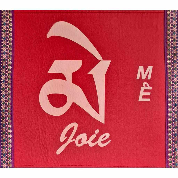 Tapis de méditation rouge avec symbole Om et mot 'Joie', bordure tibétaine traditionnelle