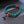 Bracelet bouddhiste en turquoise avec perles rouges et nœud tibétain, symbole de méditation et sagesse