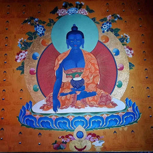 Thangka bouddhiste tibétain représentant un Bouddha bleu, symbole de la philosophie bouddhiste et de la méditation.
