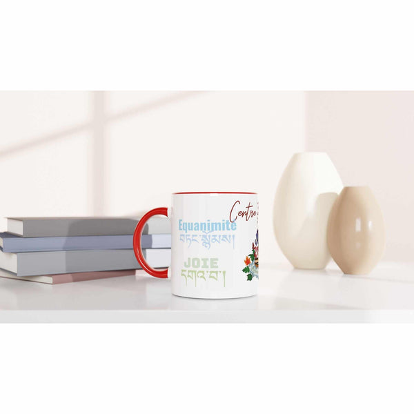 Mug bouddhiste blanc avec poignée rouge, inscriptions 'Equanimité' et 'Joie' en français et tibétain, fleurs colorées.