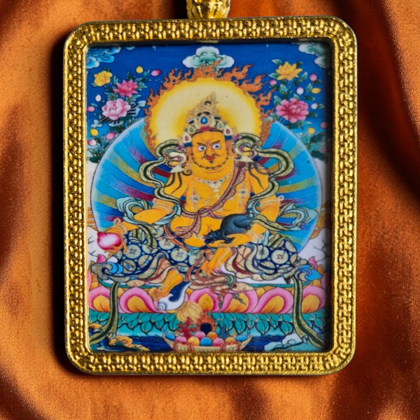 Thangka bouddhiste tibétain encadré, divinité dorée sur fond bleu, fleurs et motifs traditionnels