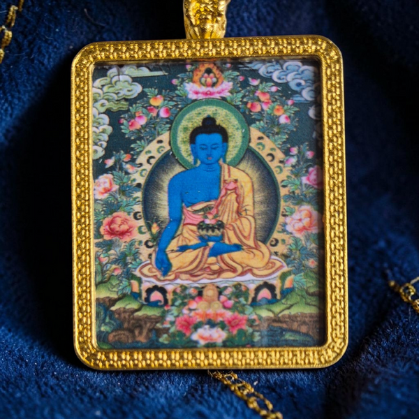 Pendentif bouddhiste avec image de Bouddha bleu, cadre doré, art tibétain traditionnel