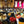 Conférence sur la méditation bouddhiste avec Lama Samten, public attentif dans salle décorée de drapeaux tibétains